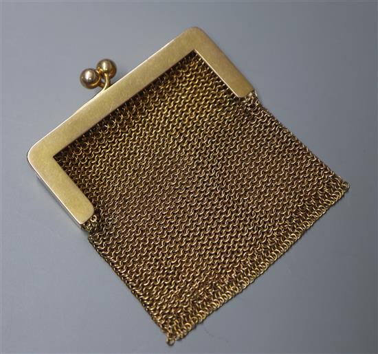 A small 14k yellow metal mesh purse.